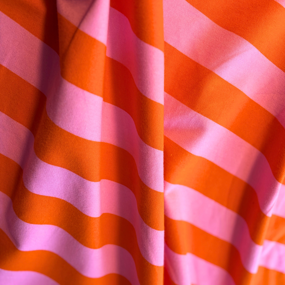 Orange and pink wide horizontal stripe brushed sweatshirting fabric 3.5cm stripe 148cm wide — 225gsm 95% cotton 5% elastane stretch knit Oeko-Tex certified for handmade sweatshirts dresses and children's clothing