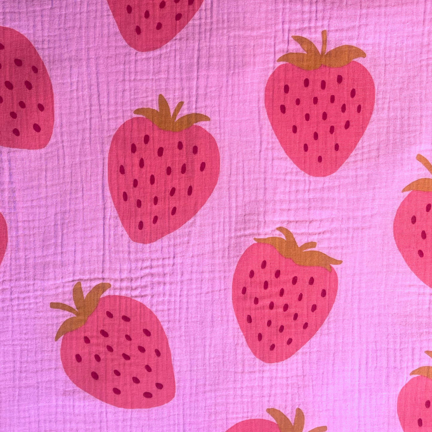 Large scale strawberry print double gauze fabric on soft washed pink base, 135cm wide — featherlight 125gsm 100% cotton two-layer woven, Oeko-Tex Standard 100 certified for handmade summer dresses, children's clothing and baby muslins