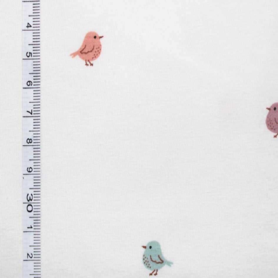Miniature birds print stretch jersey in white with muted rose, putty and teal bird motifs folded to show soft knit construction — breathable cotton elastane fabric ideal for handmade baby and children's clothing and gifts