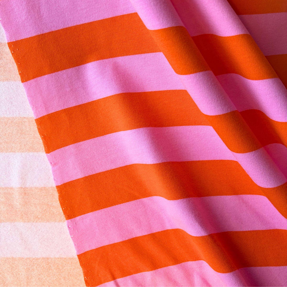 Orange and pink horizontal stripe brushed sweatshirting fabric 3.5cm stripe — Oeko-Tex certified 95% cotton 5% elastane 225gsm stretch knit for slow fashion sweatshirts joggers and co-ord sets